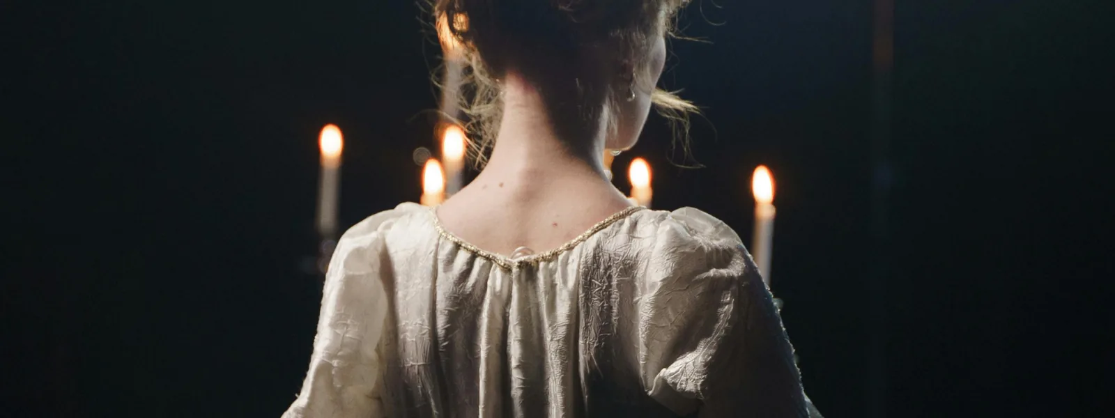Candle-lit portrait, mood image for the Characters block
